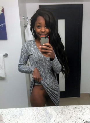 Sexy black girl flashing her round ass..